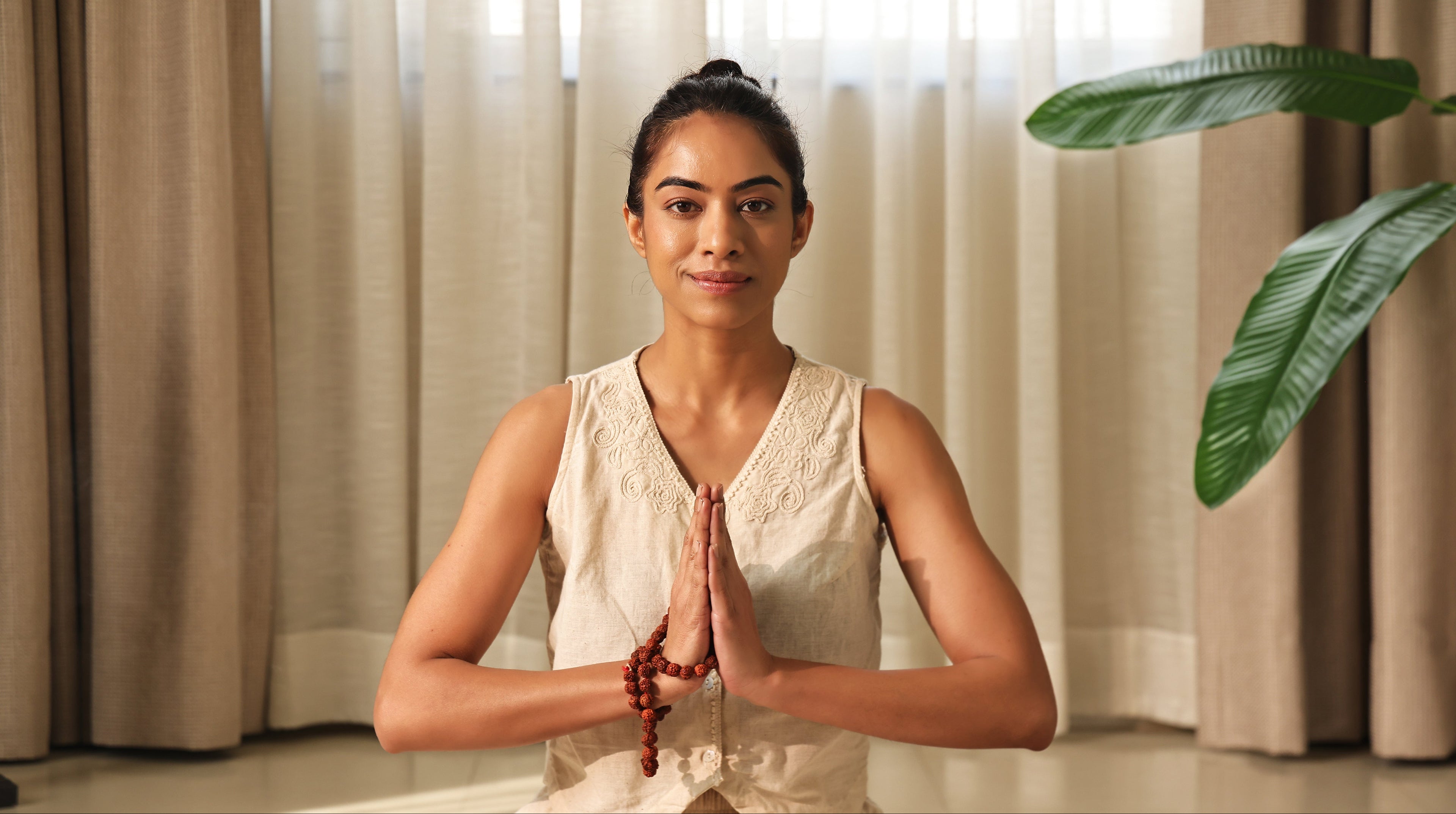 Ayurveda Dosha Quiz by Art of Vedas - Woman in Meditation Namaste Pose for Discovering Your Ayurvedic Body Type Vata Pitta Kapha